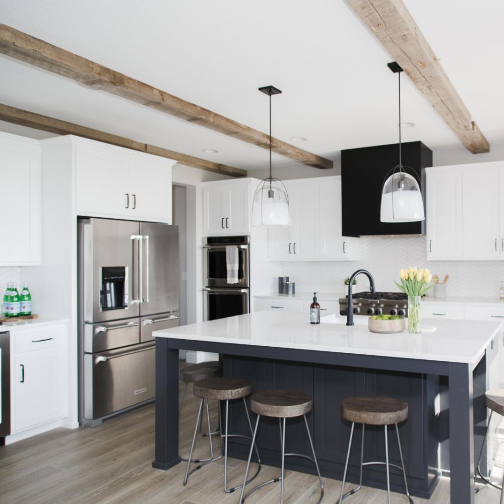 Reclaimed Wood Ceiling Beams and Mantel | Dakota Timber Company | Rustic Timber Beams | Studio West Fargo | Homebuilders in Fargo | Light Sanded Ceiling Beams | Modern Living Room