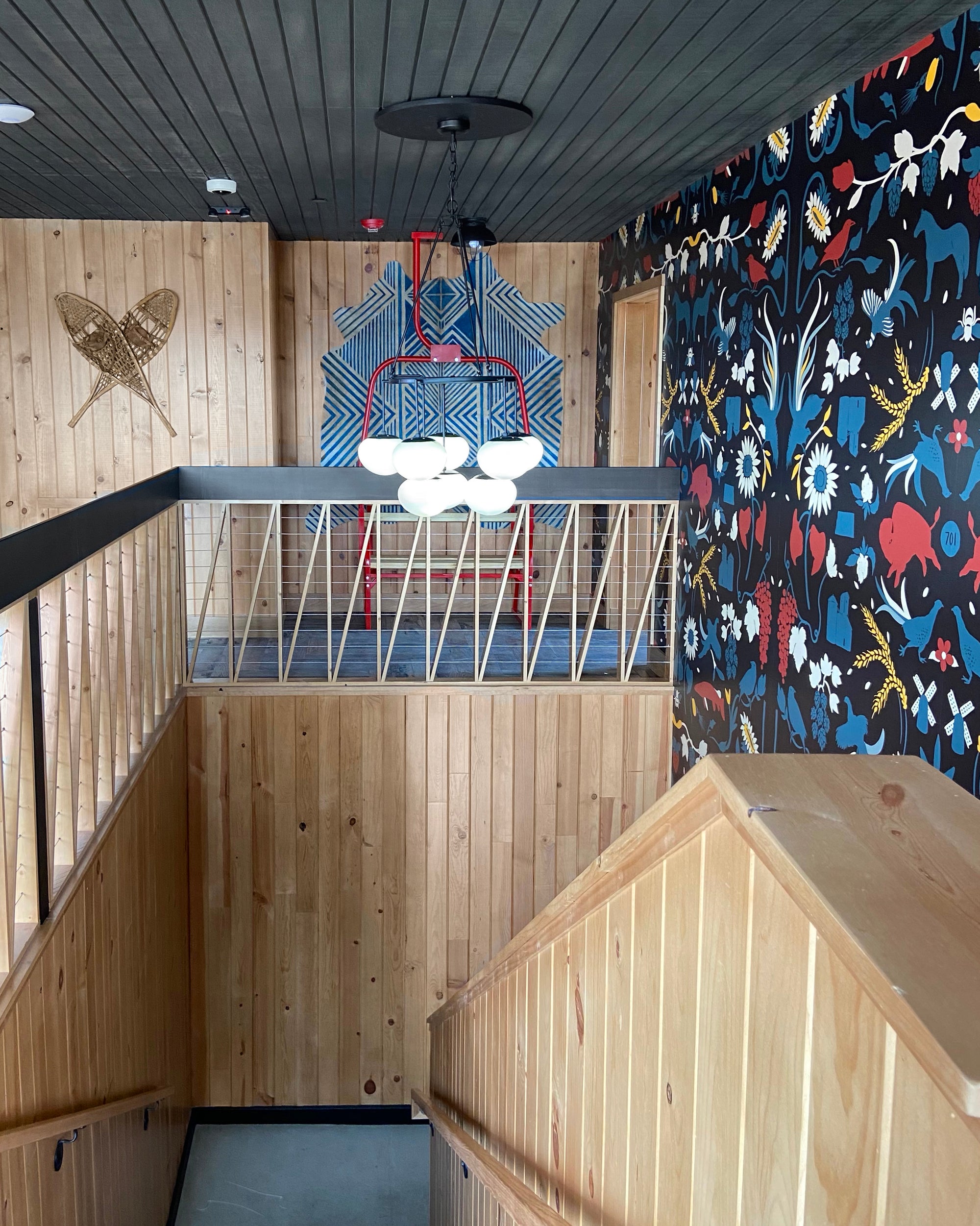 Pine Paneling Stairwell | 701 Eateries in Fargo, ND | Interior Design Fargo | Shiplap Ceiling Paneling | Dakota Timber Company Wood | Sustainable Building Companies | Gray Shiplap Ceiling