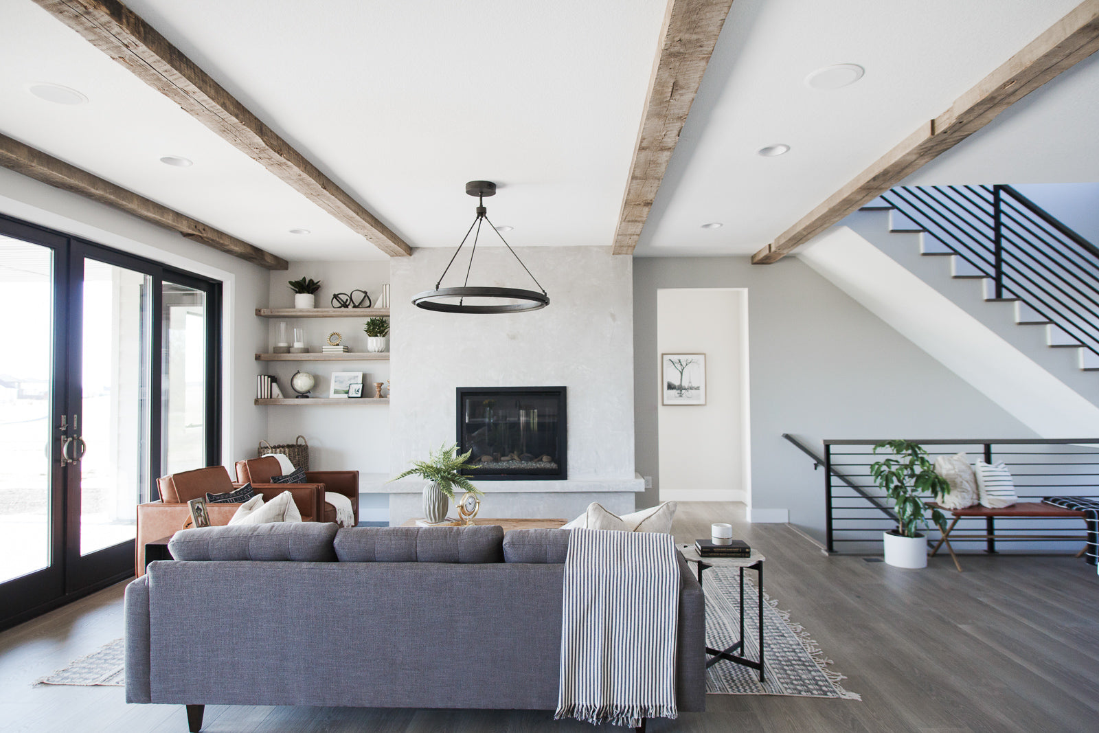 Reclaimed Wood Ceiling Beams and Mantel | Dakota Timber Company | Rustic Timber Beams | Studio West Fargo | Homebuilders in Fargo | Light Sanded Ceiling Beams | Modern Living Room