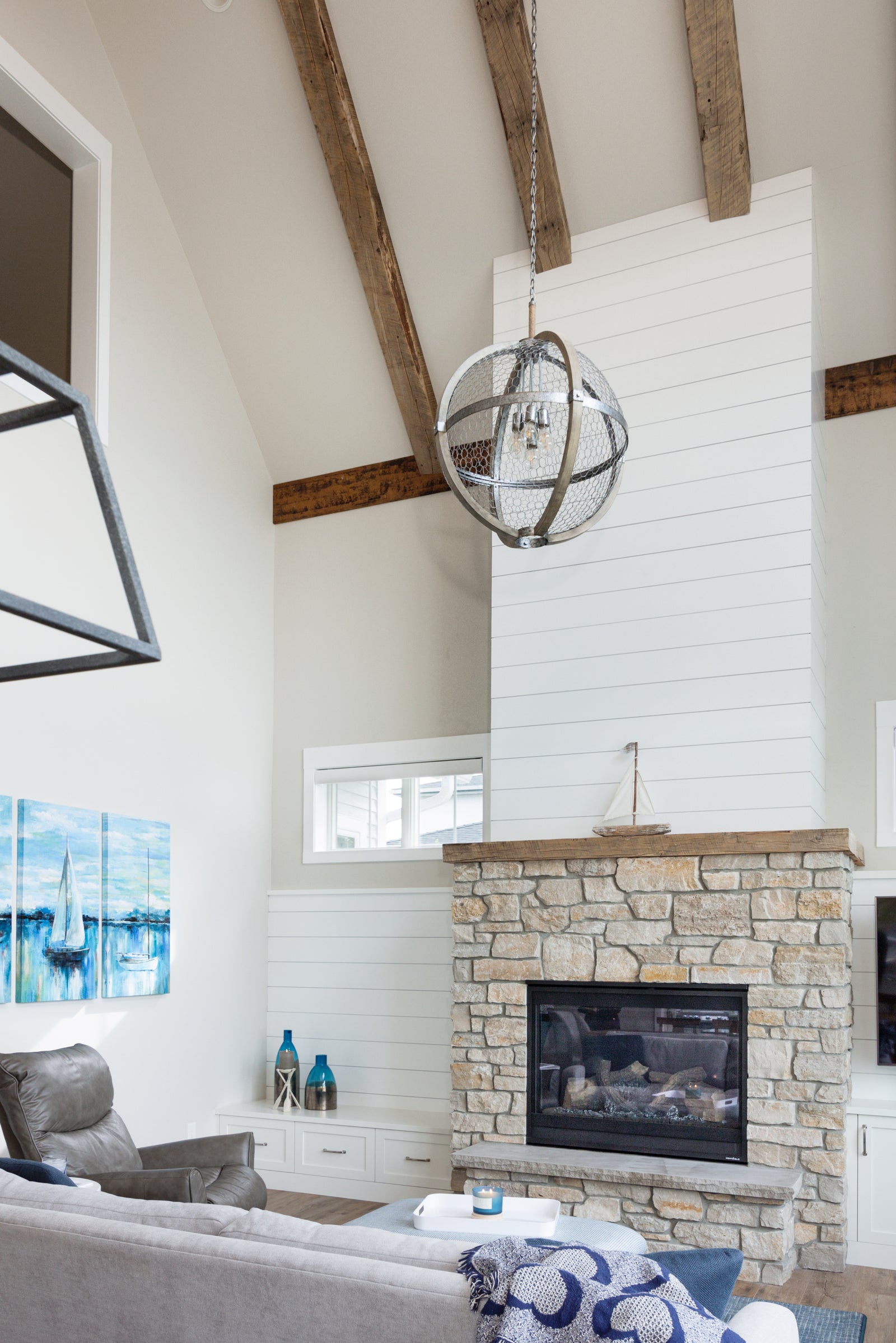 Reclaimed Wood Ceiling Beams and Mantel | Dakota Timber Company | Rustic Timber Beams | White Shiplap Fireplace Surround | Fargo Custom Home Builder