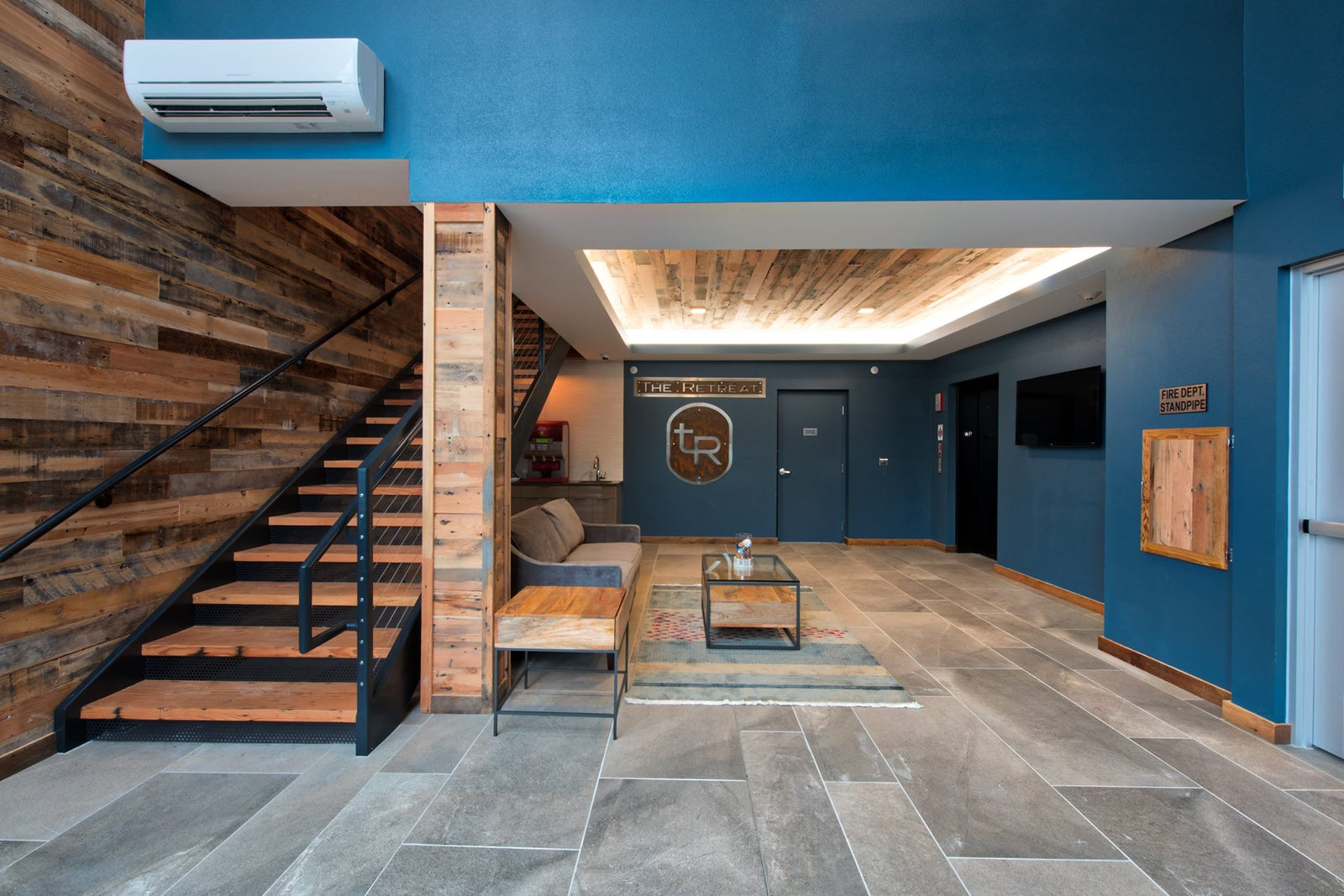 Reclaimed Wood Wall Paneling Down Stairwell | Staircase Wood Paneling | Rustic Wood Ceiling Paneling | Barnwood Planking Ceiling | Dakota Timber Company | Shiplap and Paneling | Custom Stair Treads | Fargod