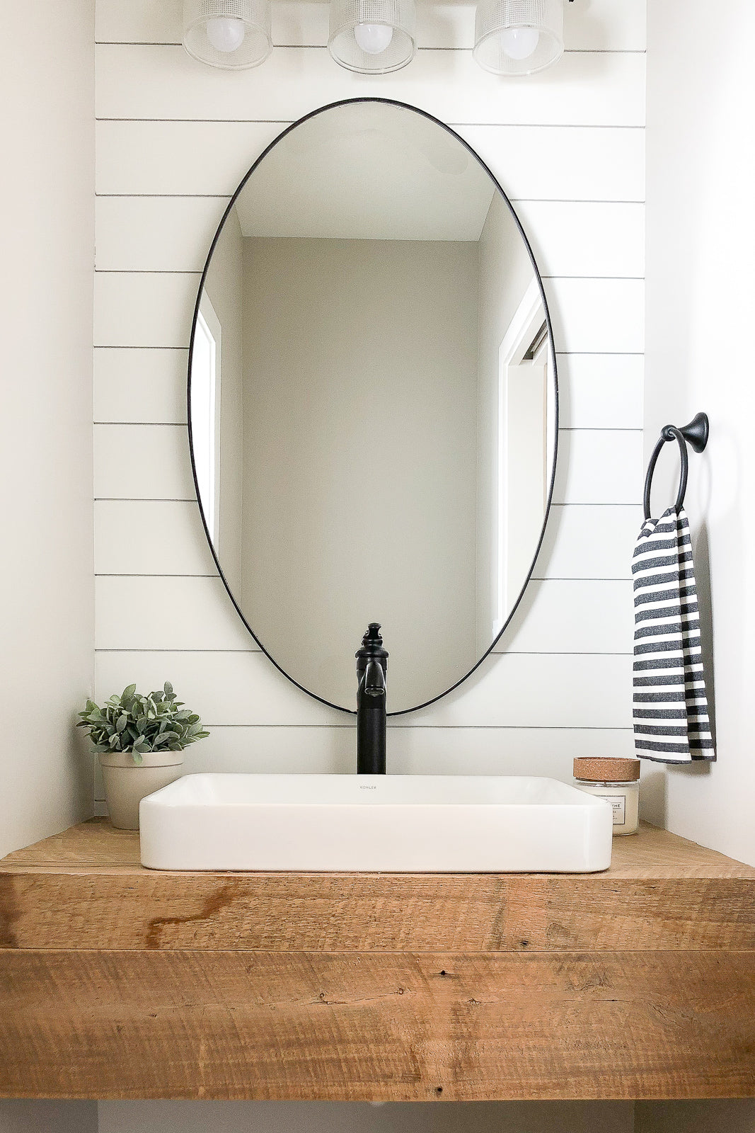 White Shiplap Wall Bathroom | Studio West Fargo | Dakota Timber Company Shiplap Paneling | Reclaimed Wood Vanity | Fargo Custom Home Builders